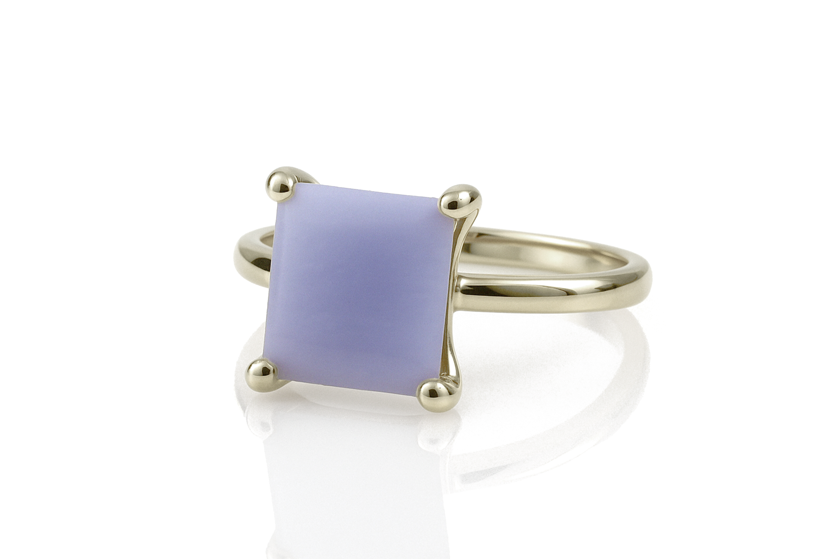 a yellow gold ring with a purple stone