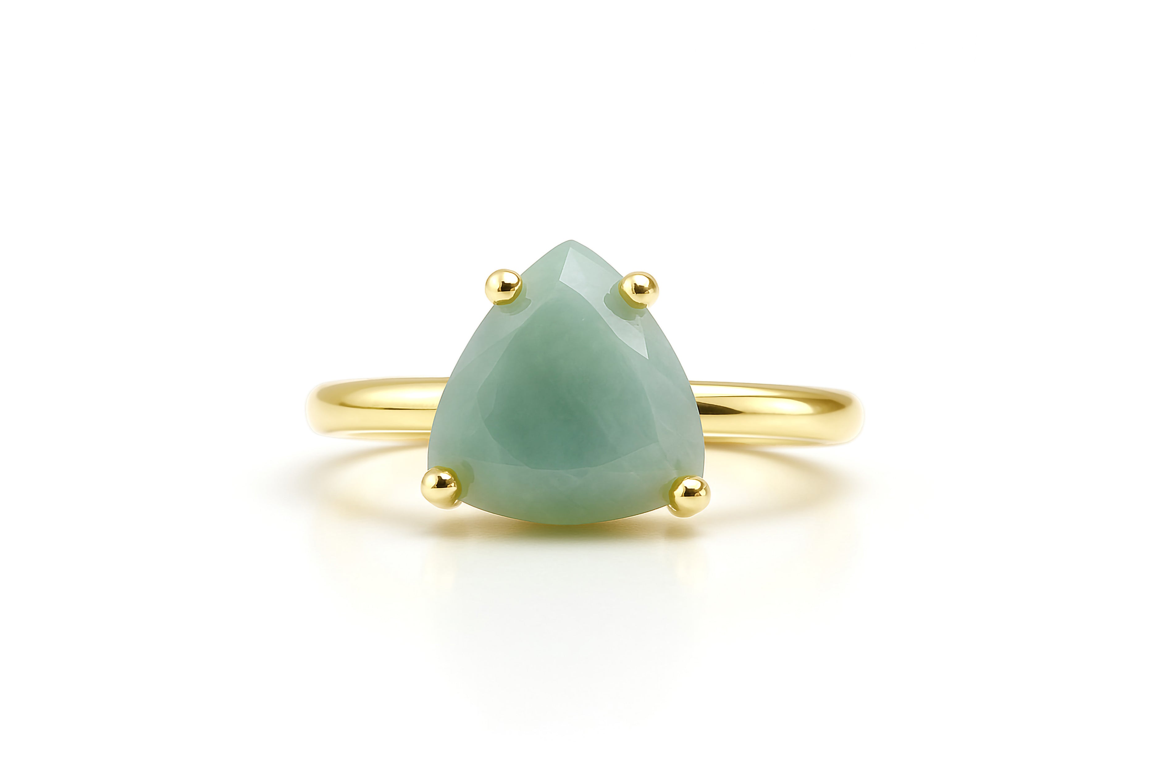a yellow gold ring with a green stone