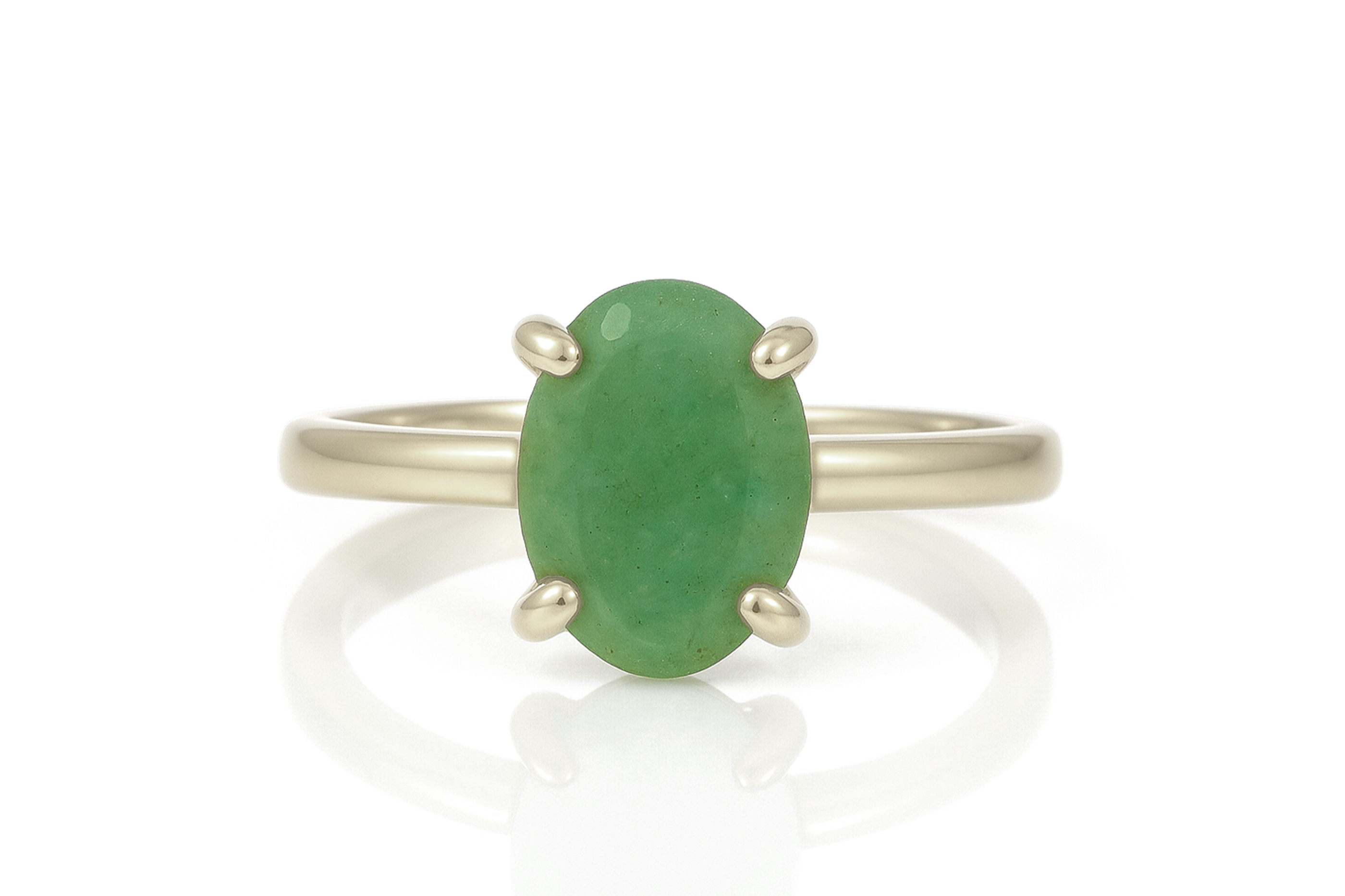 a ring with a green stone on it