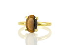a yellow gold ring with a brown stone