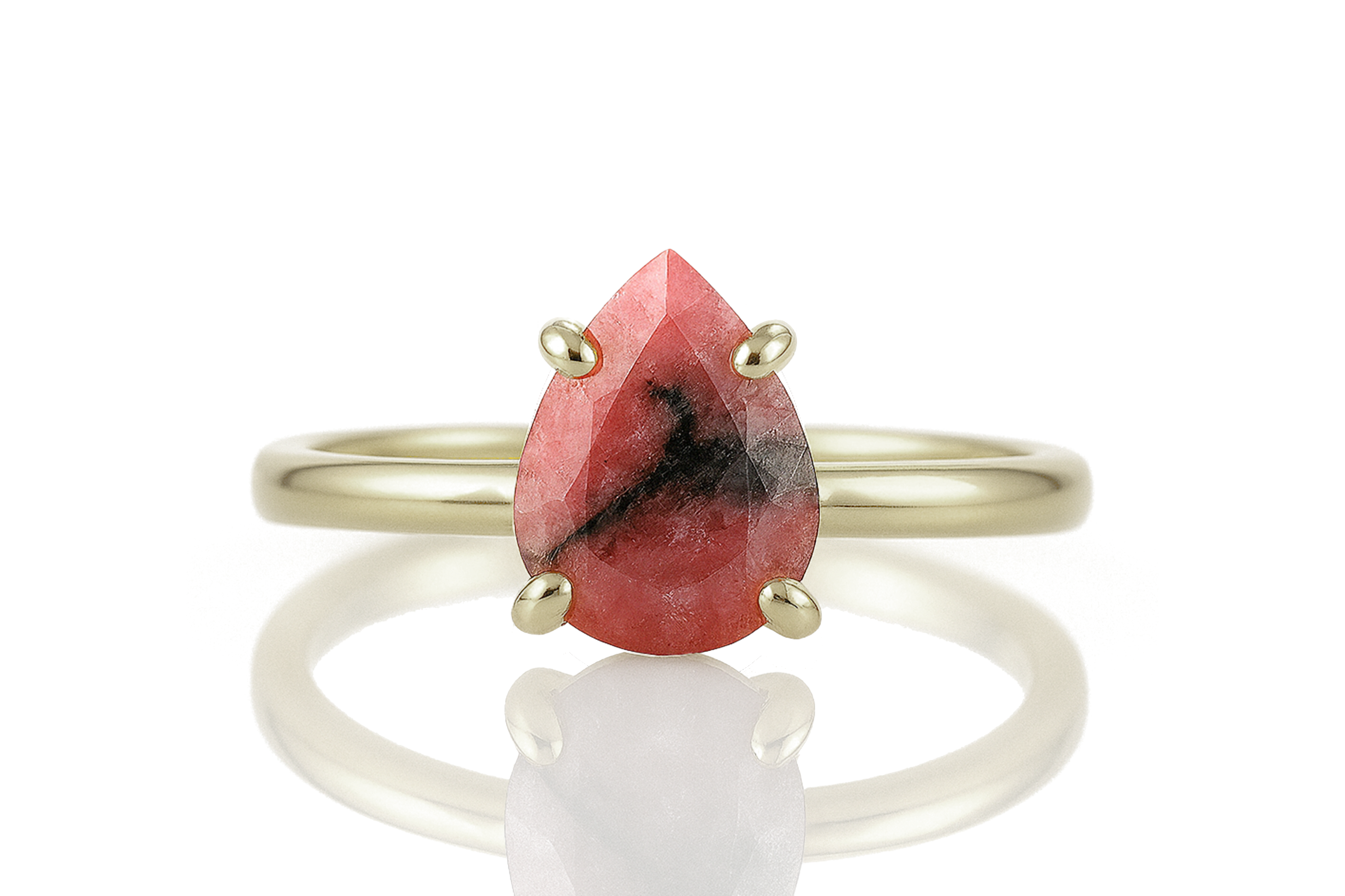 a gold ring with a red stone on it