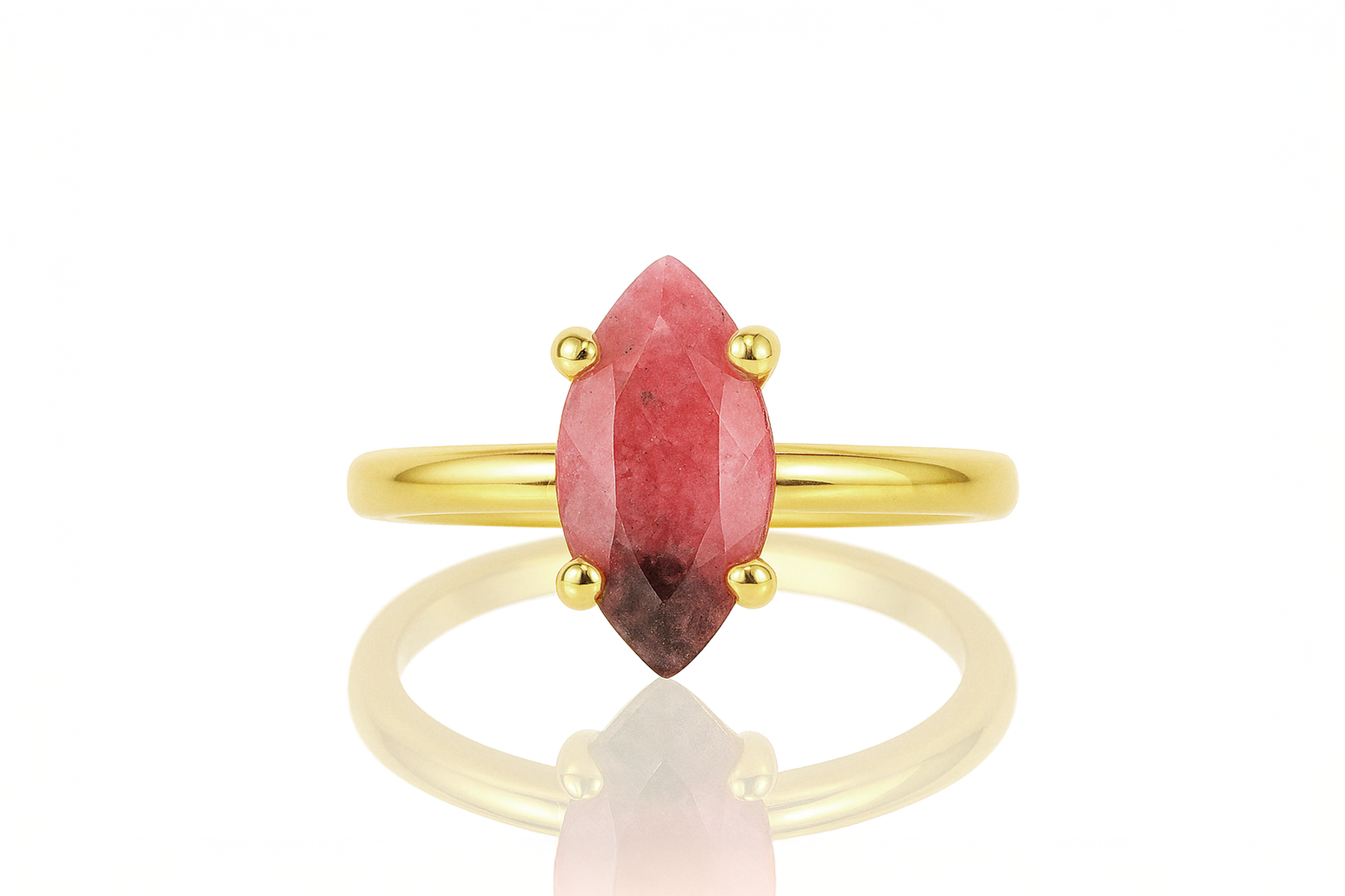 a yellow gold ring with a red stone
