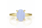 a yellow gold ring with a blue stone