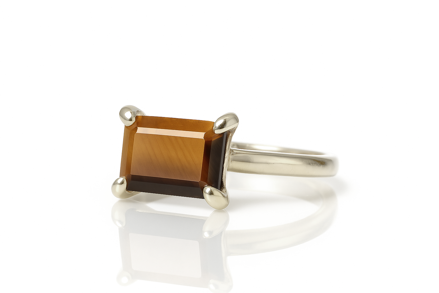 a silver ring with a brown stone on it
