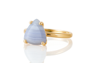 a gold ring with a blue stone on it