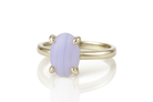 a yellow gold ring with a purple stone
