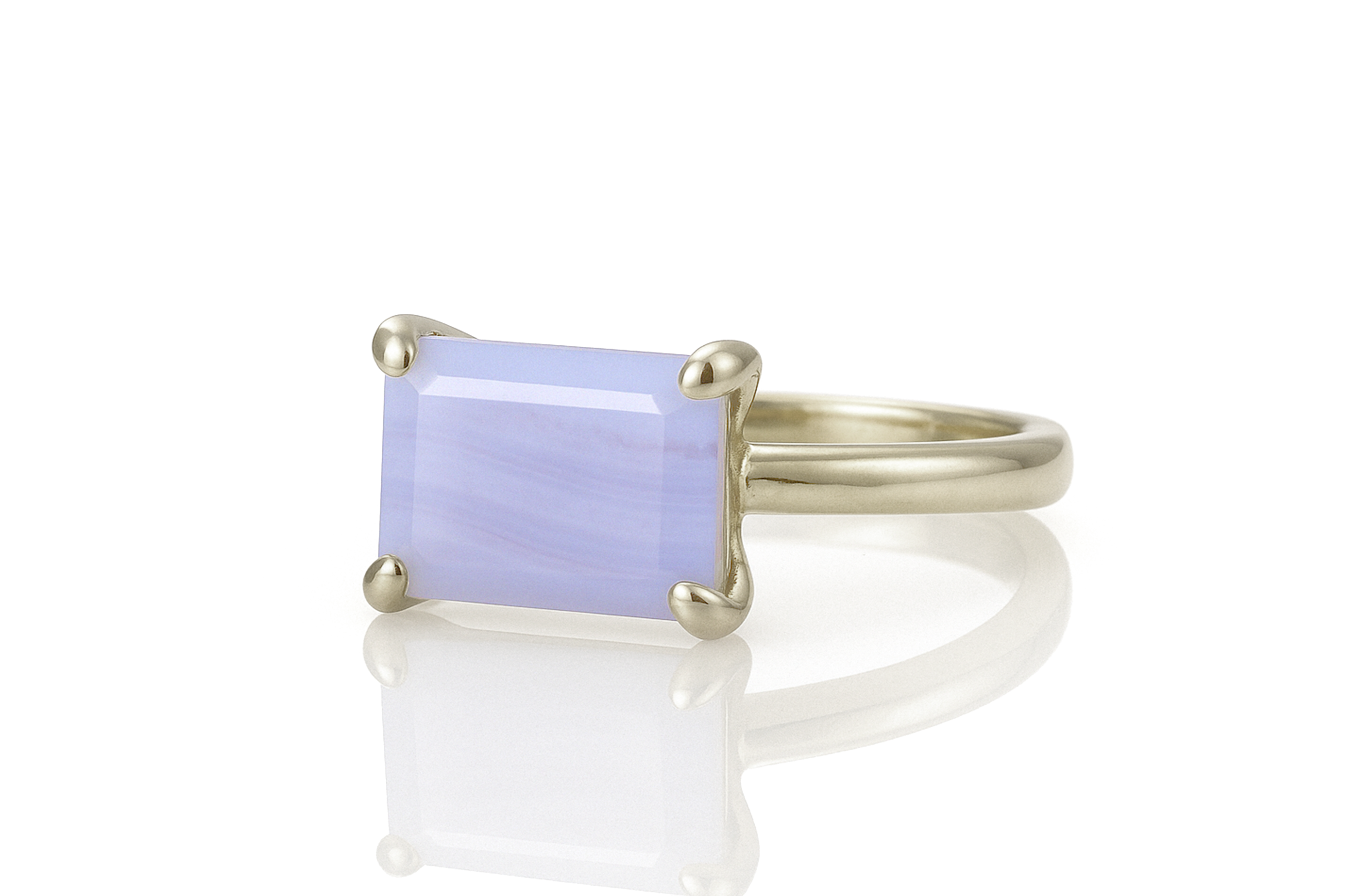 a gold ring with a blue stone on it