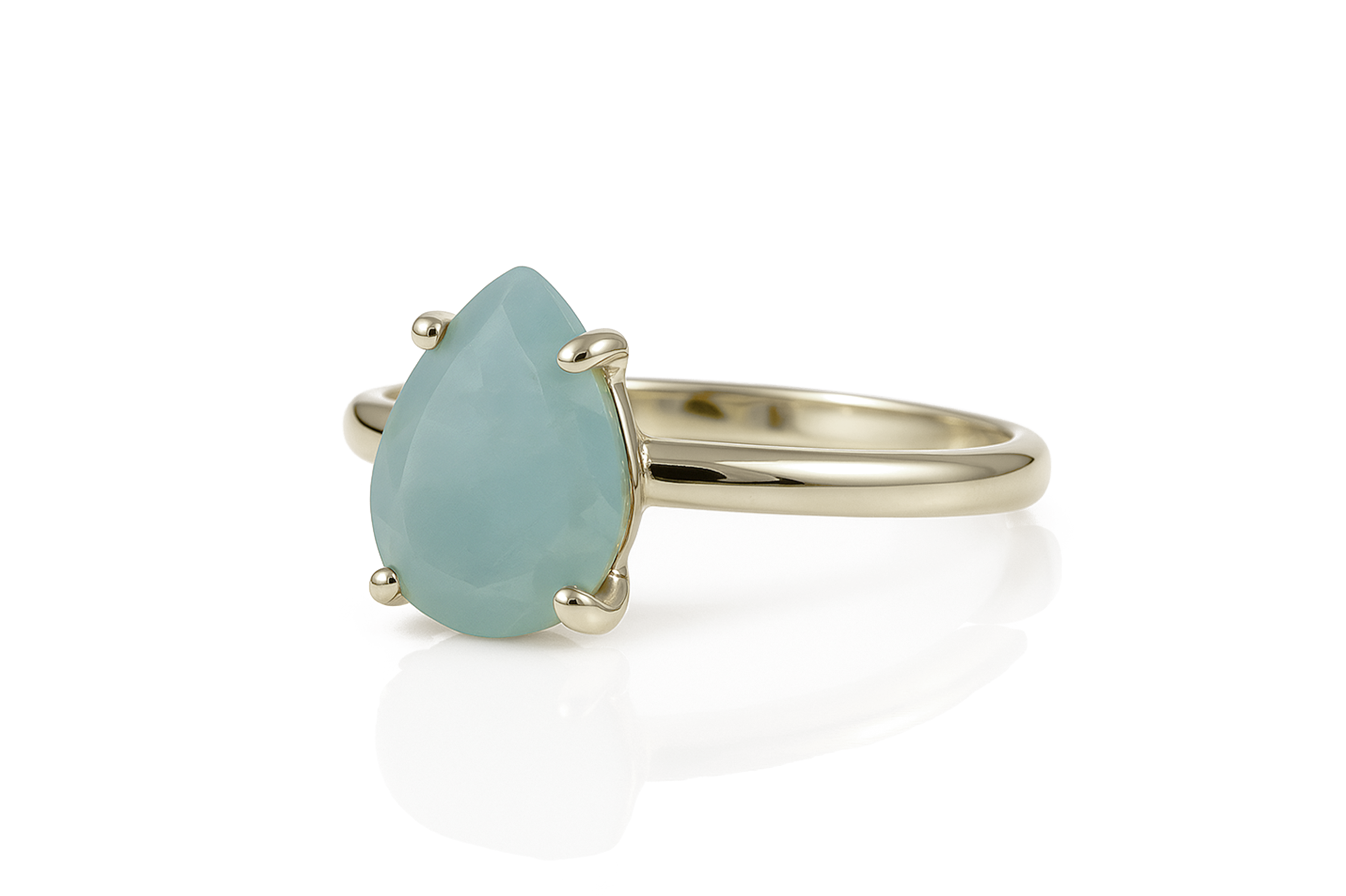 a gold ring with a blue stone on it
