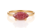 a gold ring with a pink stone on it
