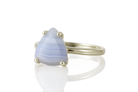 a ring with a blue tear shaped stone