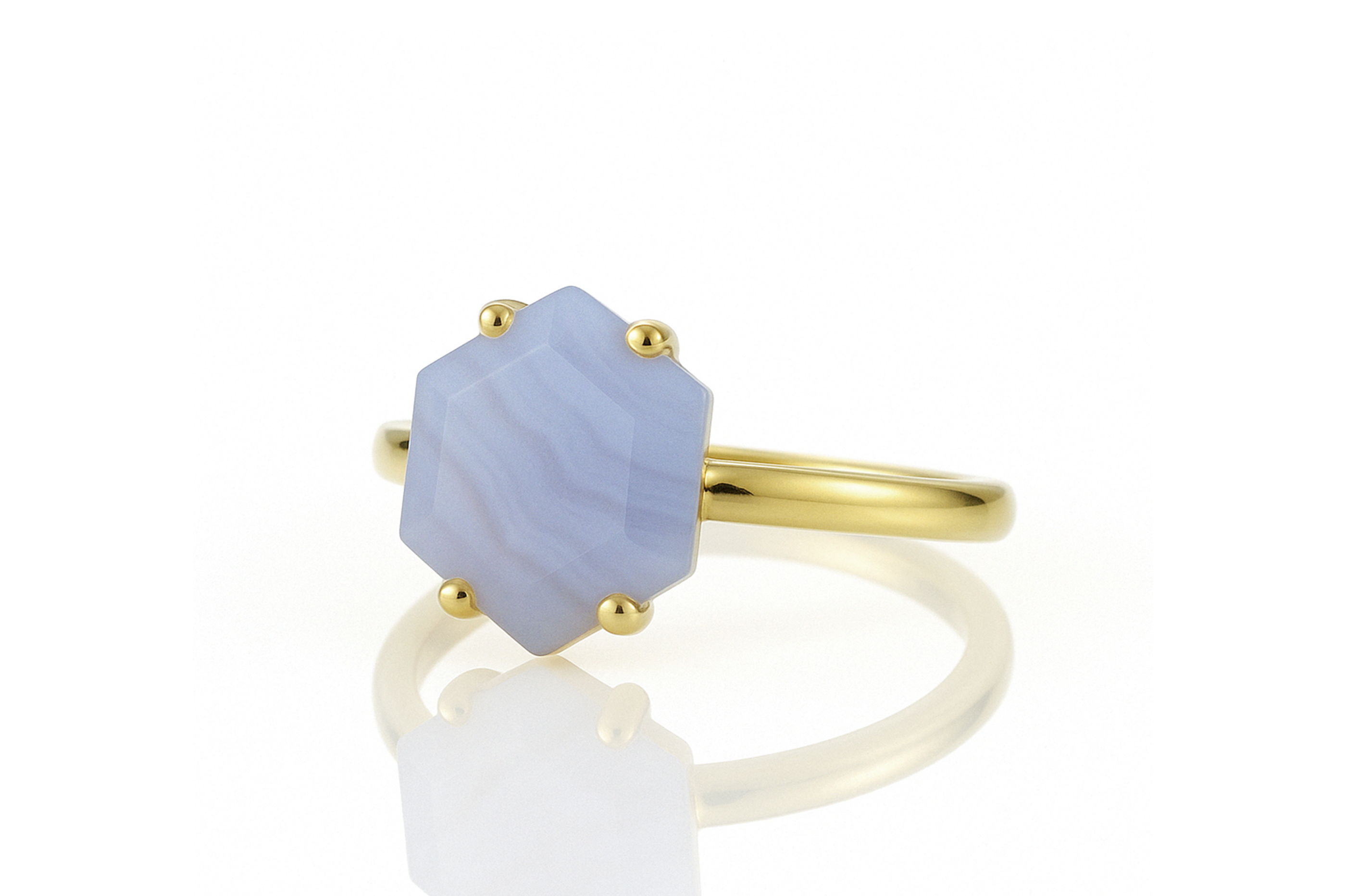 a gold ring with a blue stone on it