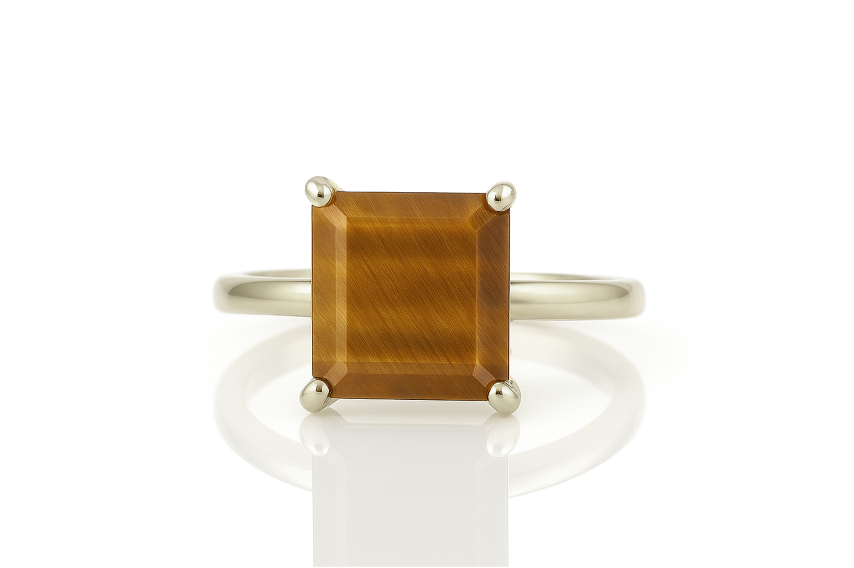 a gold ring with a brown stone on it