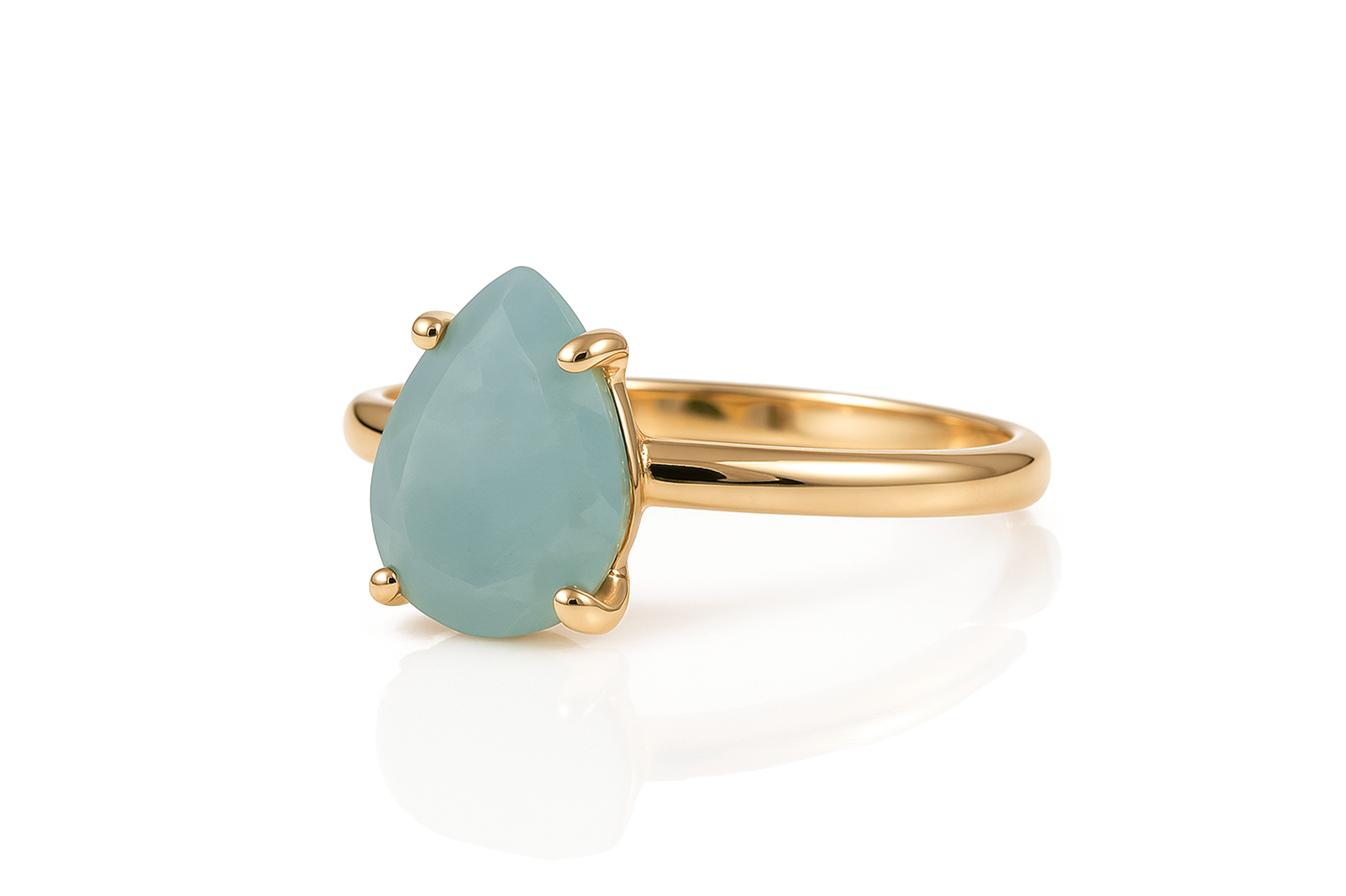 a yellow gold ring with a blue stone