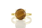 a yellow gold ring with a brown stone