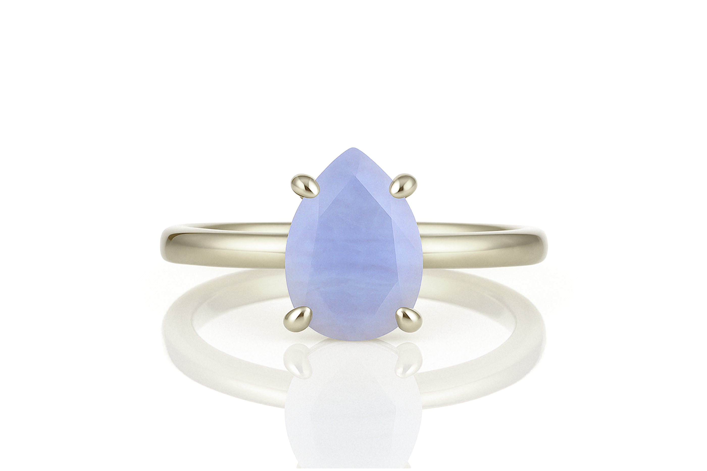 a white gold ring with a blue tear shaped stone