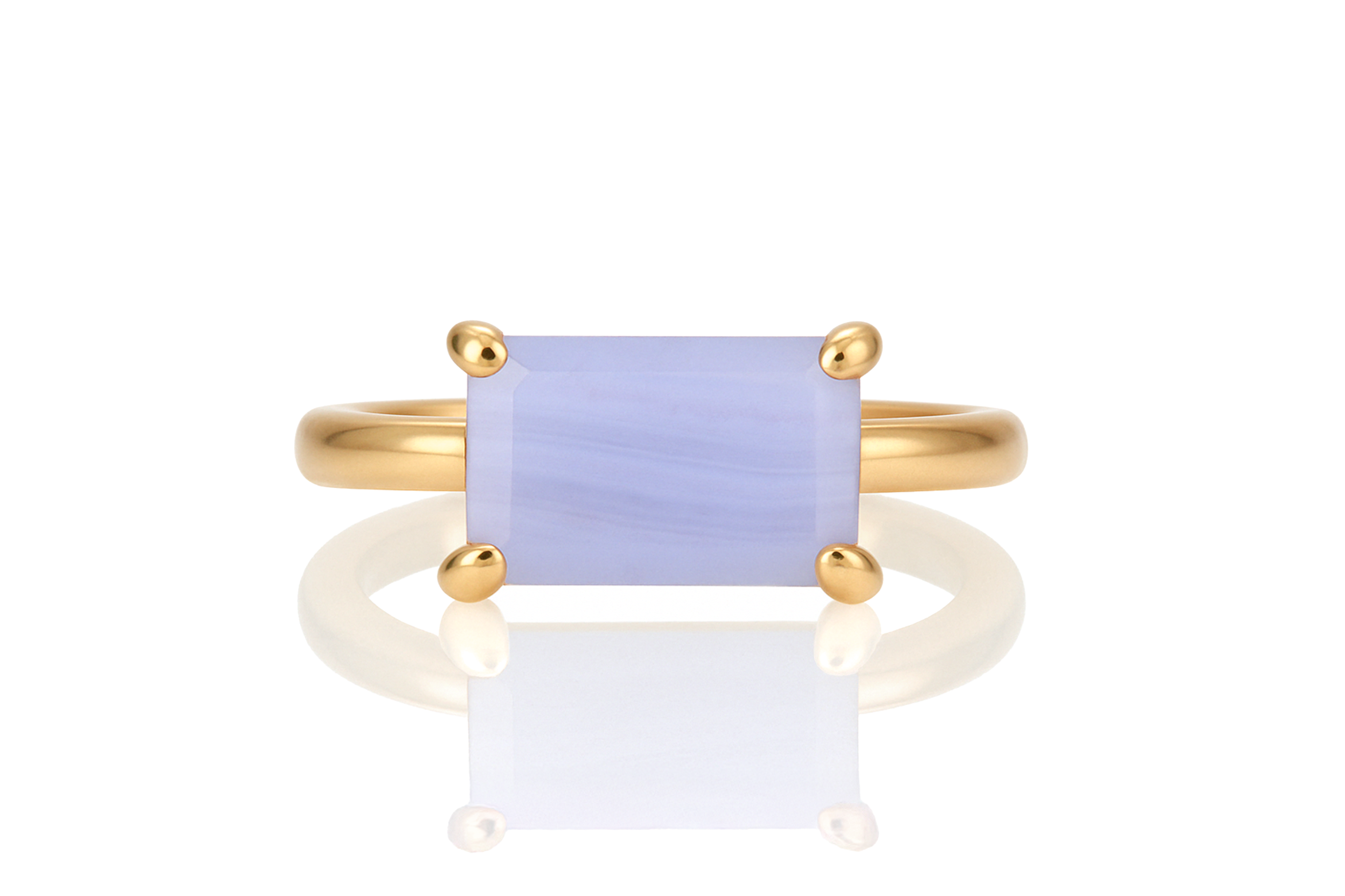a yellow gold ring with a blue stone