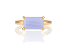 a yellow gold ring with a blue stone