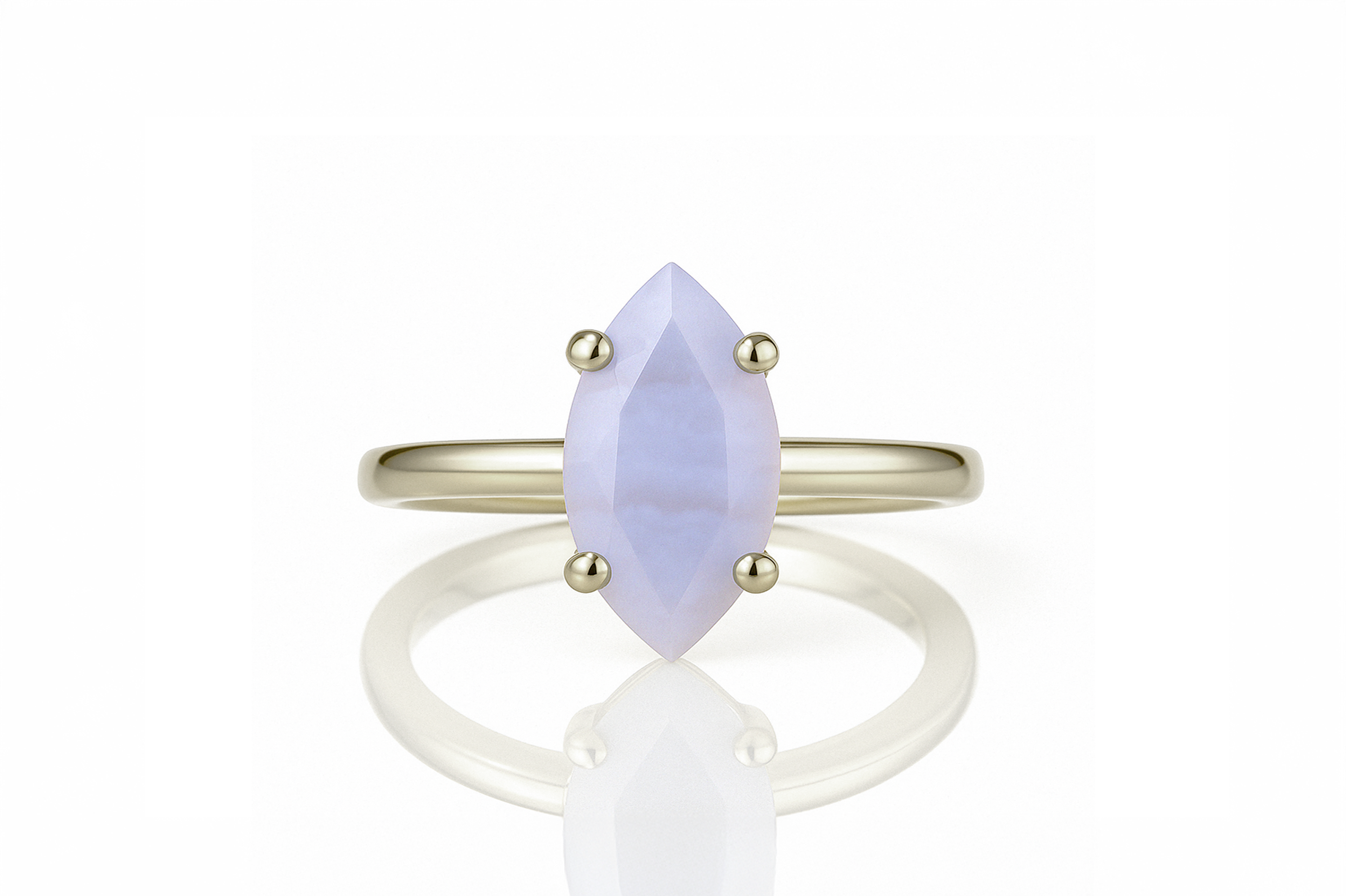 a yellow gold ring with a white stone