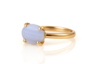 a yellow gold ring with a blue stone