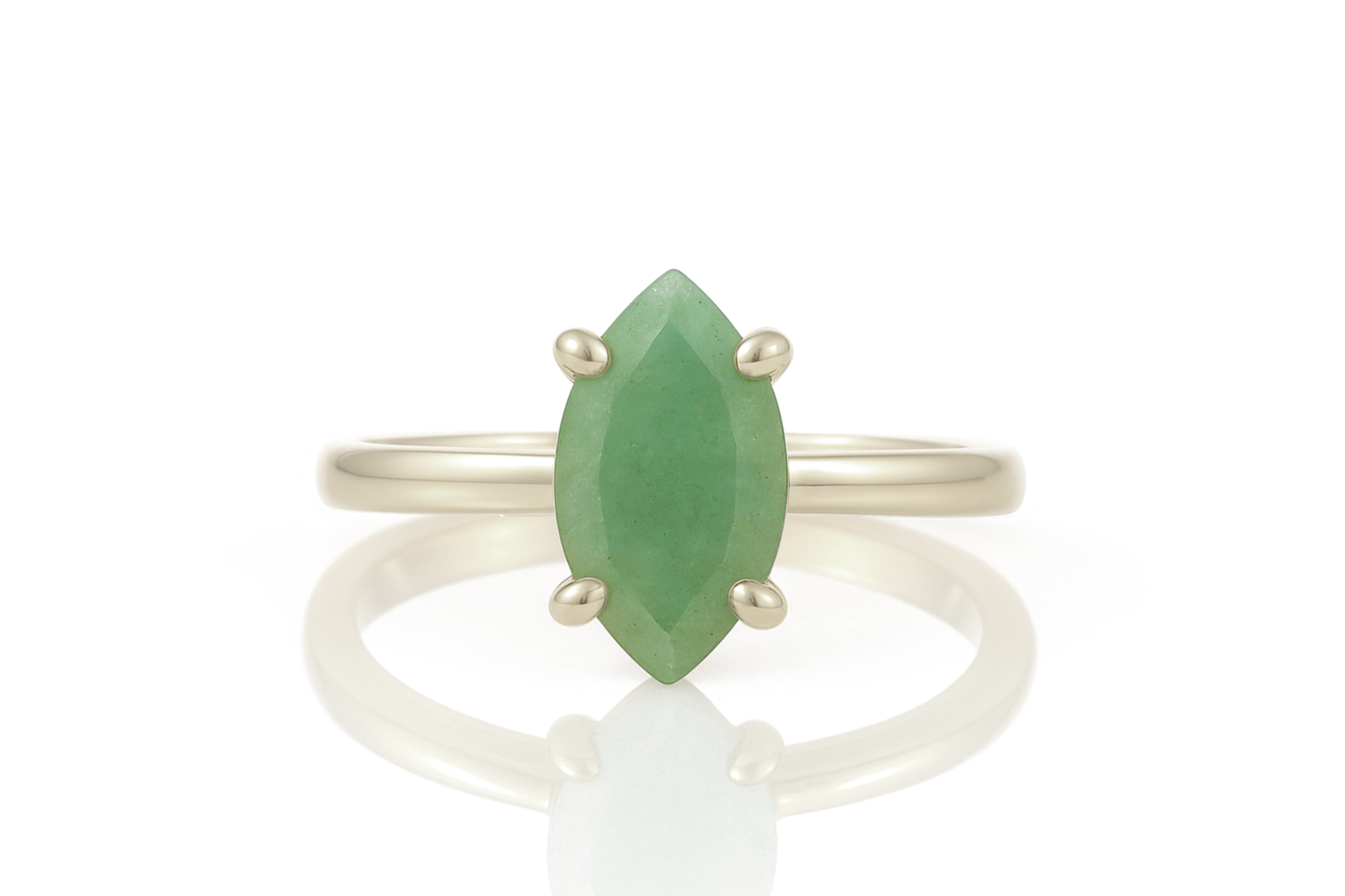 a ring with a green stone on it