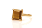 a gold ring with a square shaped stone