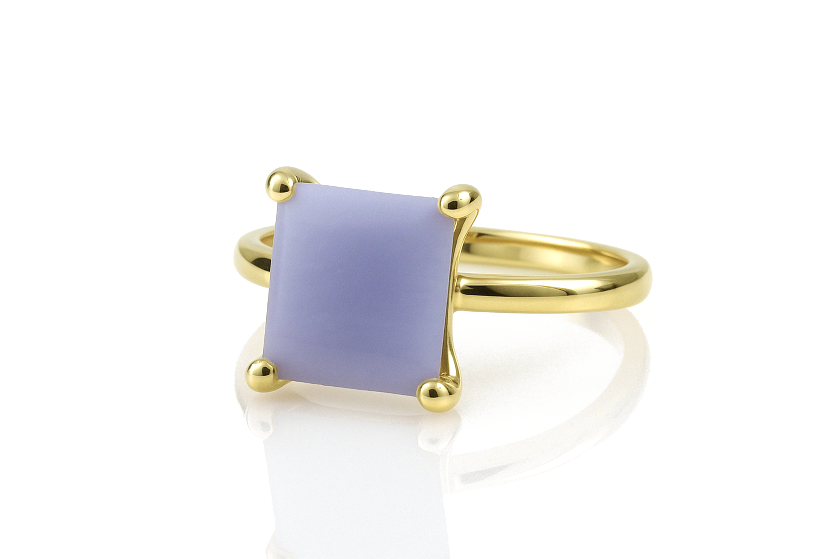 a yellow gold ring with a purple stone